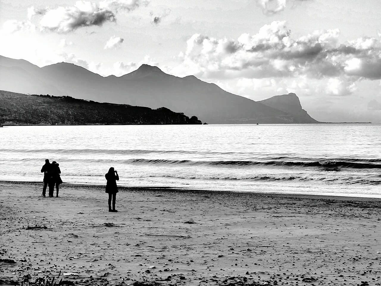 SILHOUETTE OF TWO PEOPLE ON BEACH