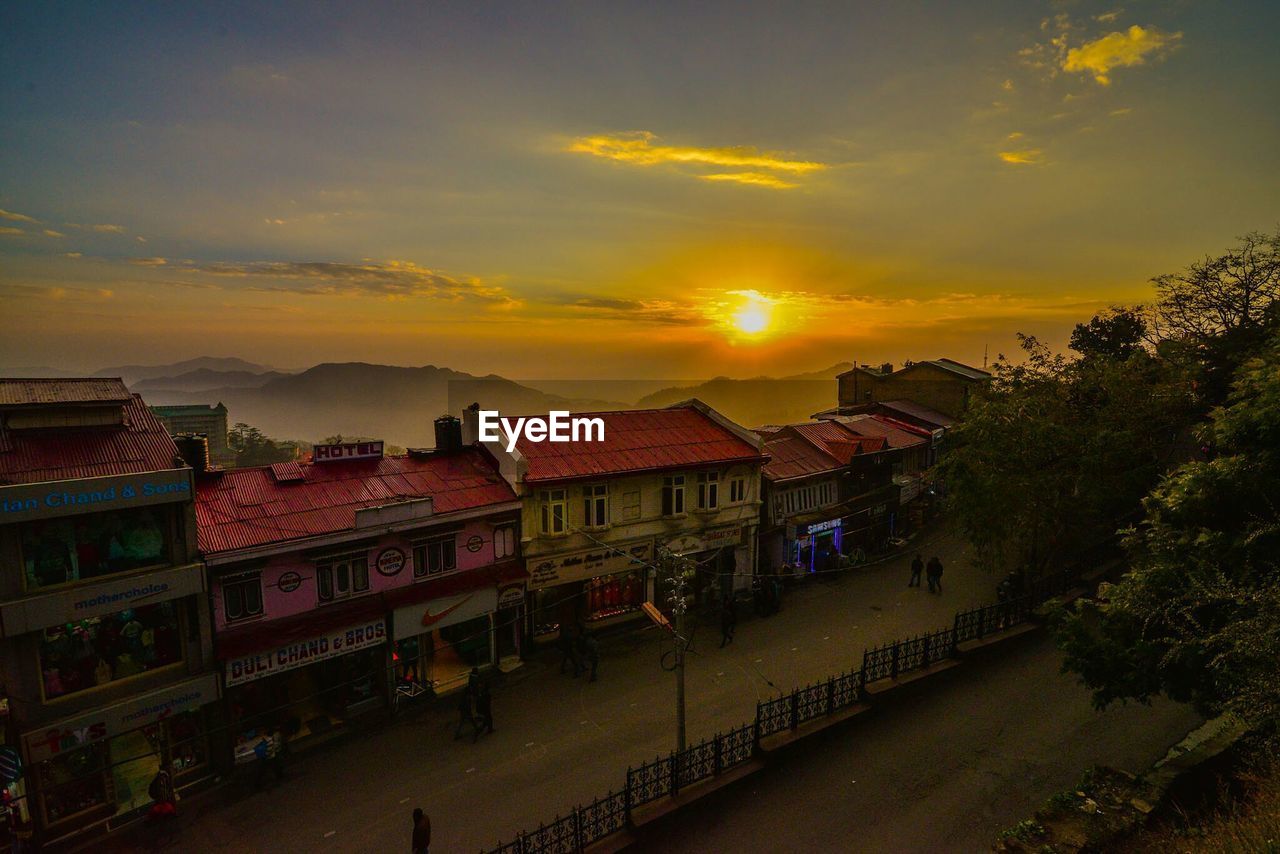 HIGH ANGLE VIEW OF TOWN AT SUNSET