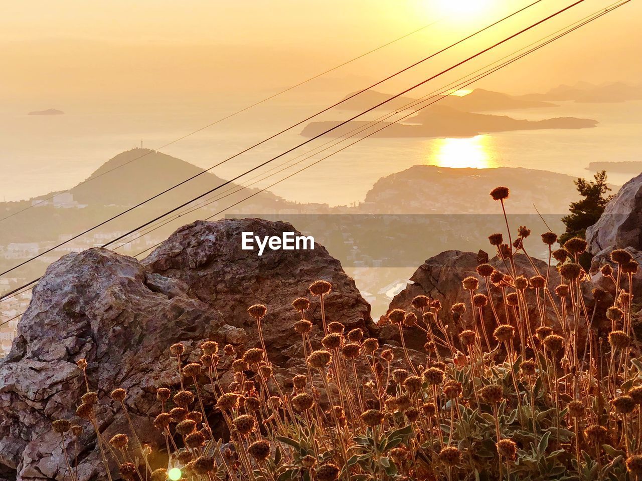 SCENIC VIEW OF MOUNTAINS DURING SUNSET