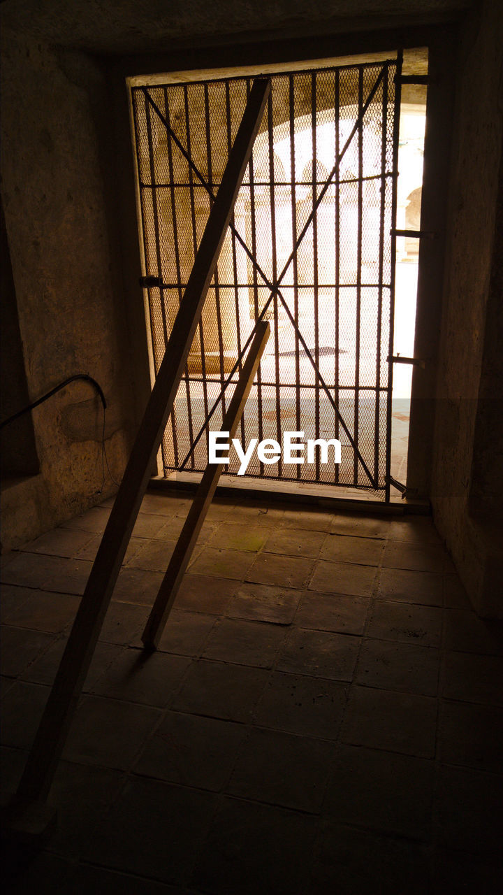 Wooden sticks in cell of old prison