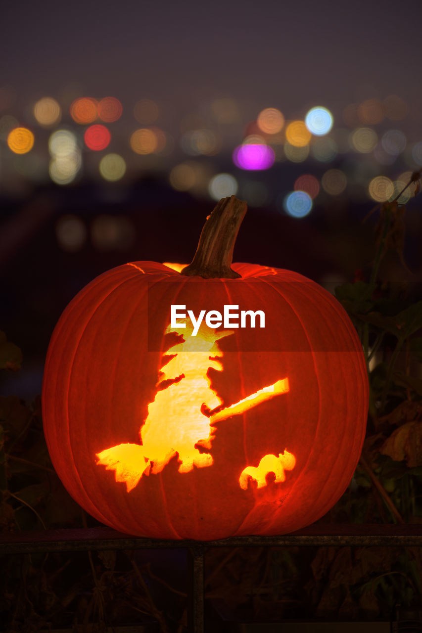 Close-up of illuminated pumpkin lantern at night