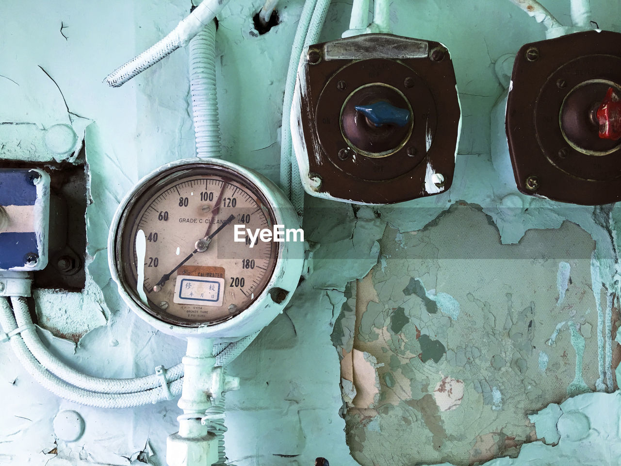 Close-up of electrical equipment on wall