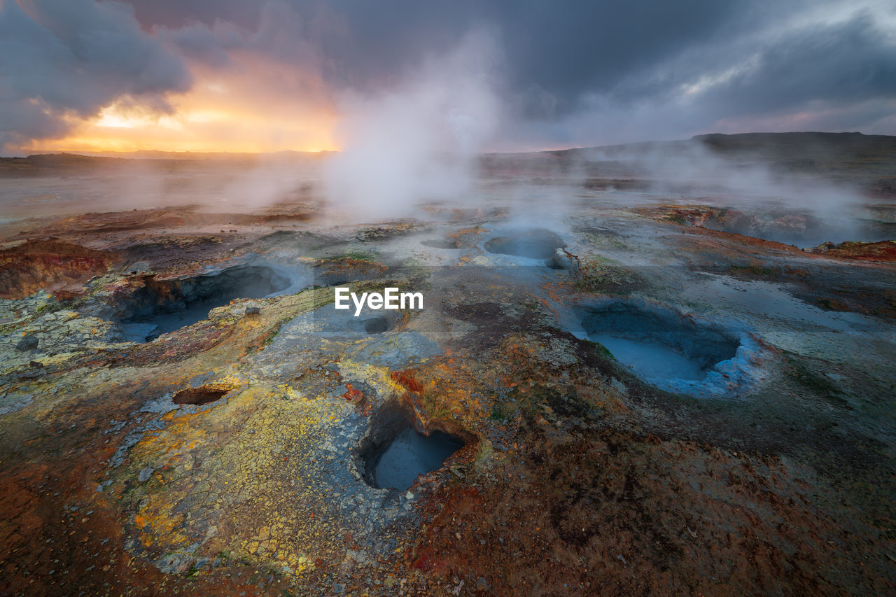 The beautiful colorful mud pools at the geothermal are in gunnuhver in iceland during sunrise. 