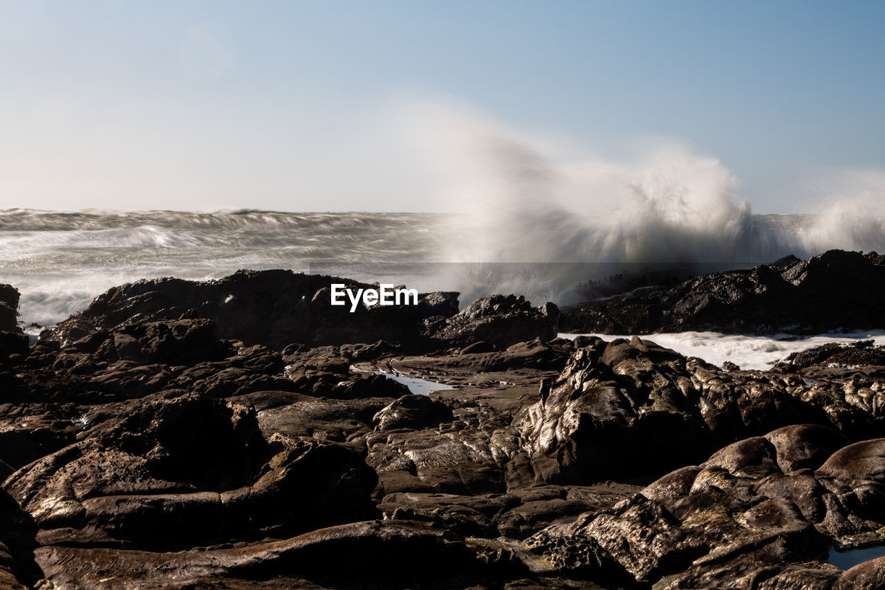 Long exposure of waves crashing on northern california coastal rocks