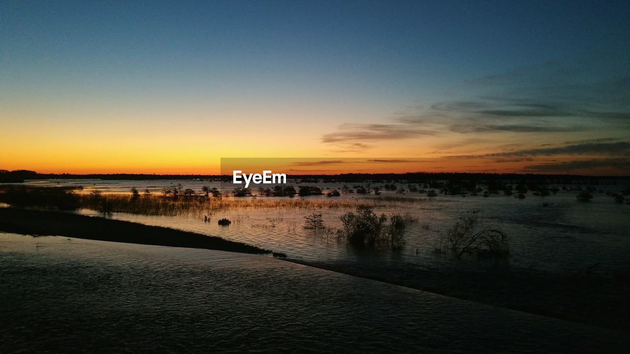 Scenic view of landscape at sunset