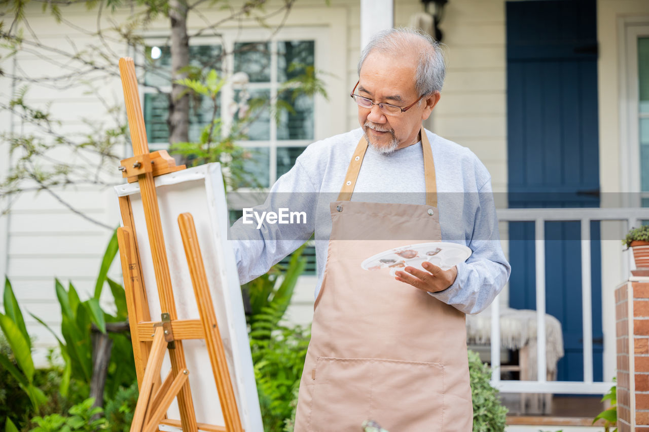 portrait of senior man using digital tablet