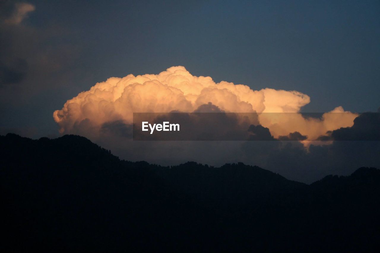 SILHOUETTE OF MOUNTAIN AGAINST SKY