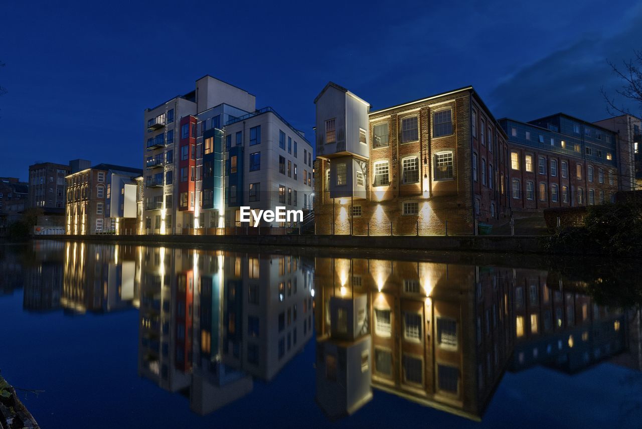 Reflection of illuminated buildings in water