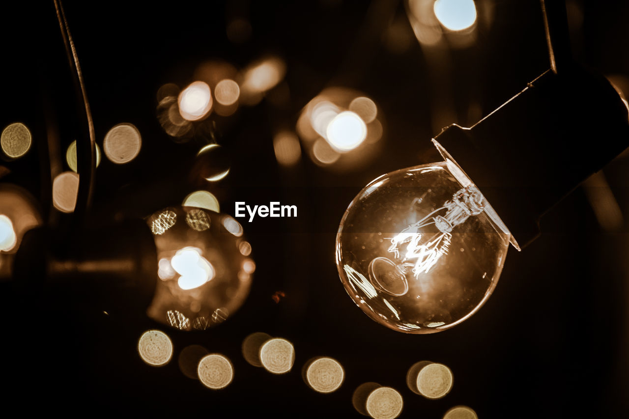 Low angle view of illuminated light bulb