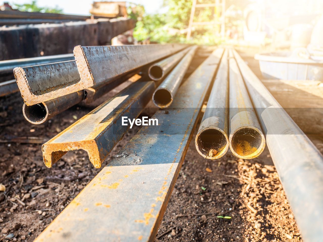 CLOSE-UP OF RAILROAD TRACK AGAINST CONSTRUCTION