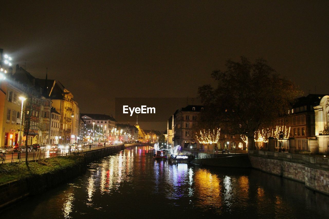 VIEW OF ILLUMINATED BUILDINGS AT NIGHT