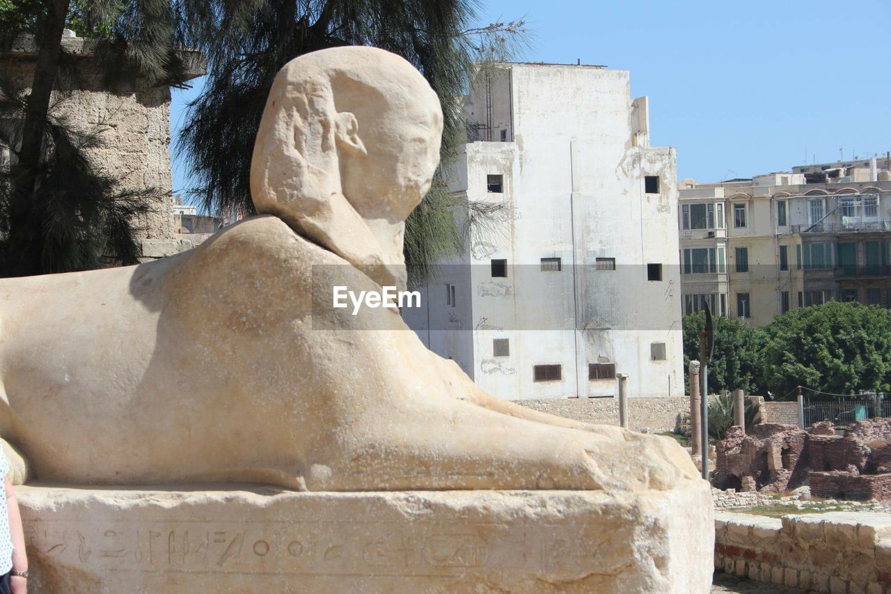 STATUE OF WOMAN IN TEMPLE