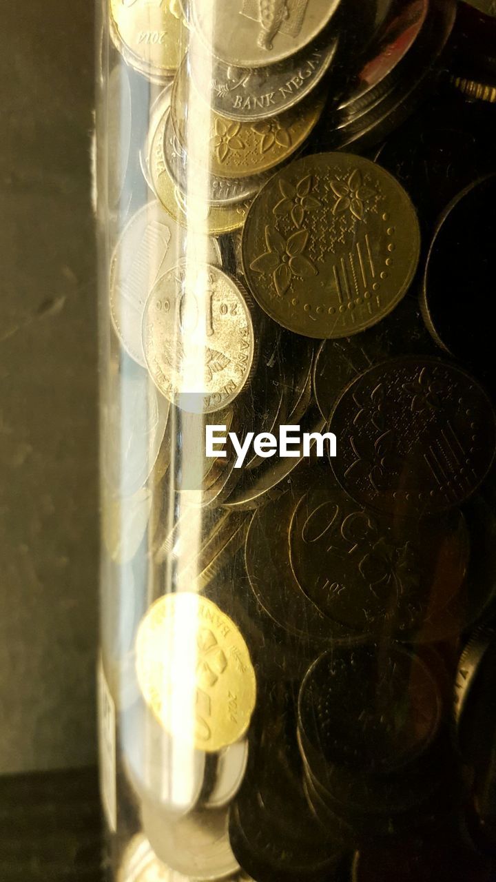 Coins in glass container