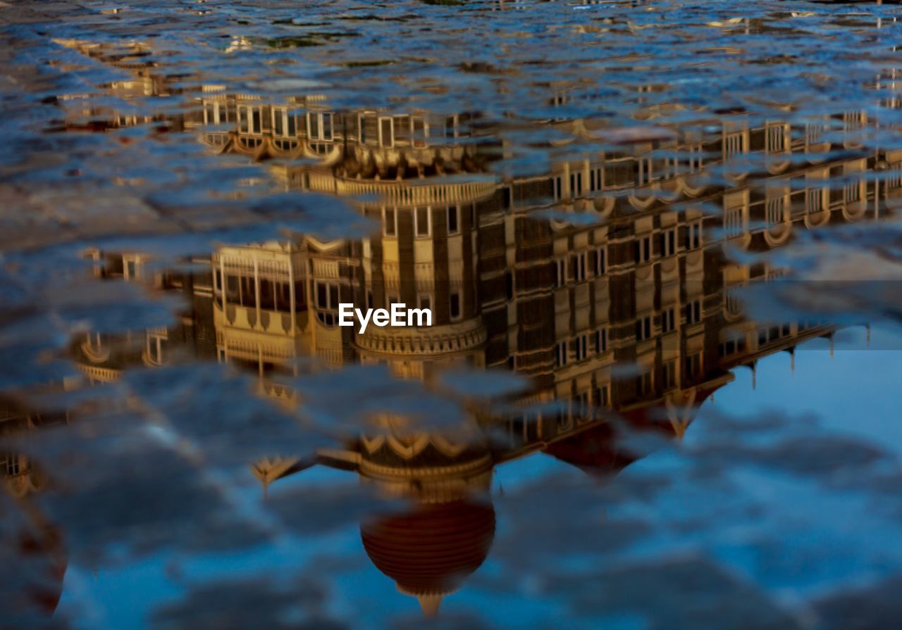 High angle view of reflection in sea against sky