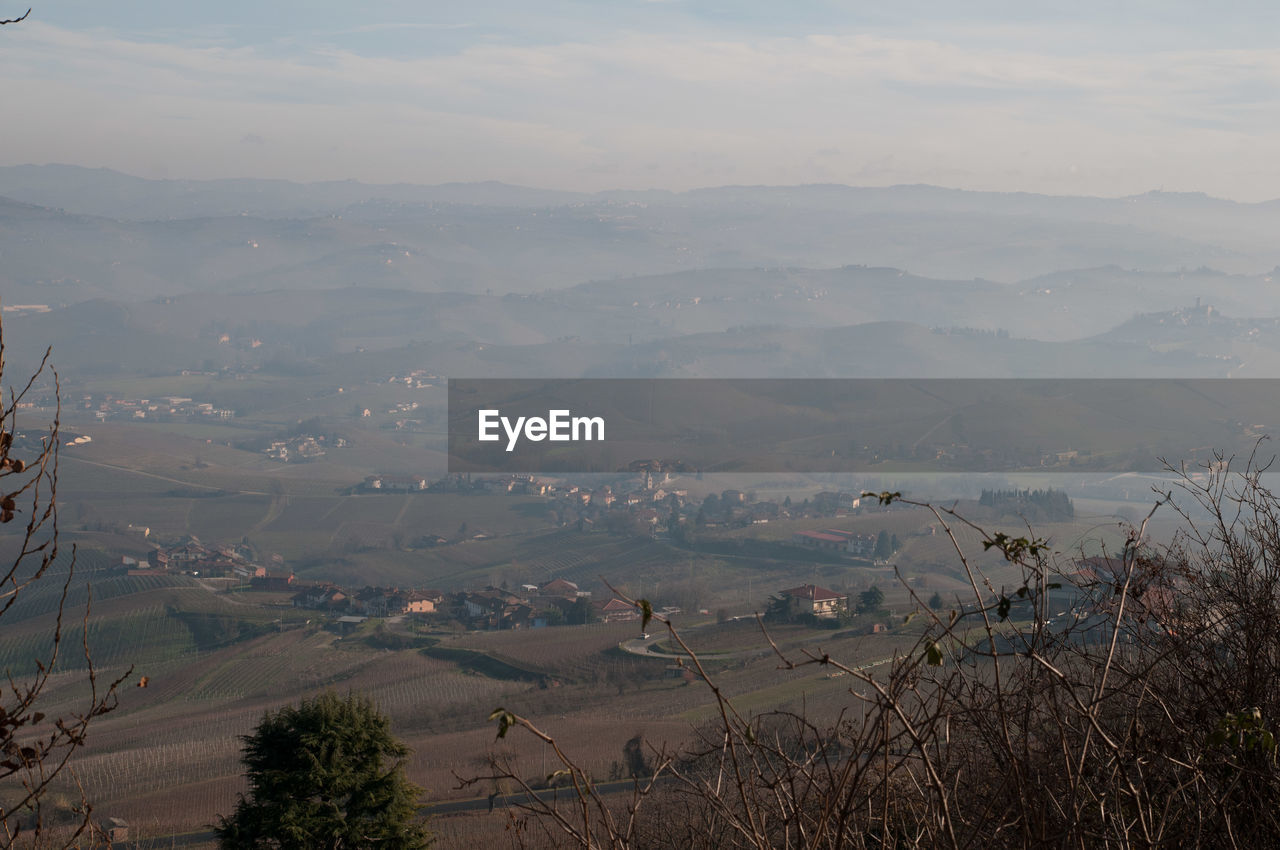 HIGH ANGLE VIEW OF MOUNTAINS AGAINST SKY