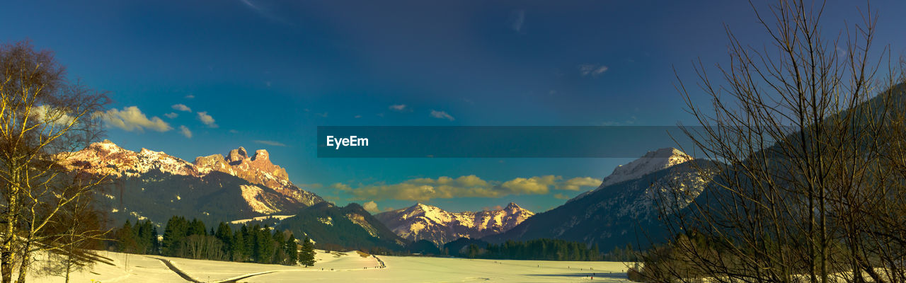 Scenic view of mountains against sky during winter