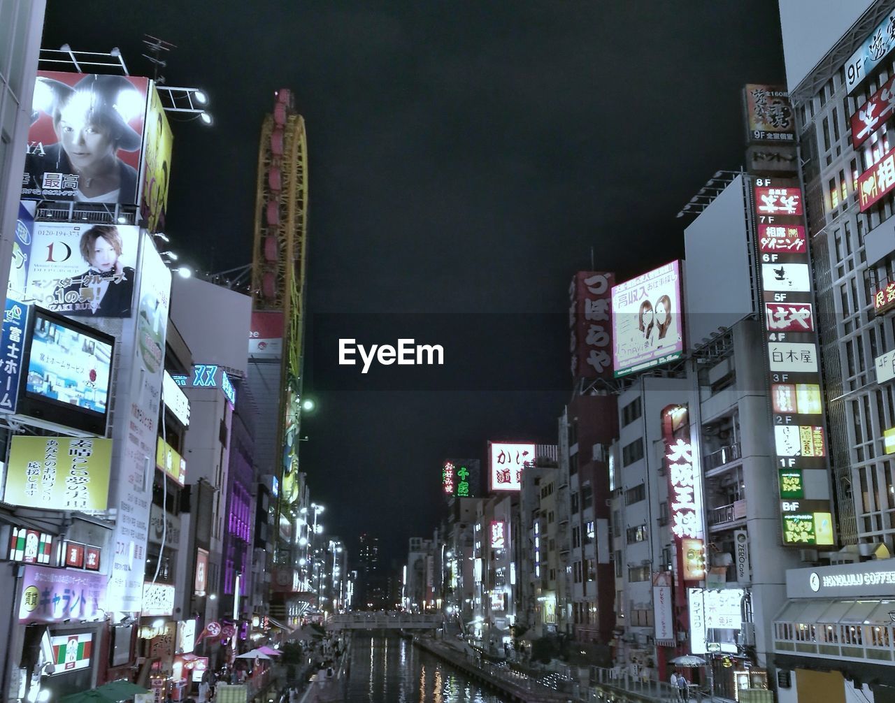 VIEW OF CITY LIT UP AT NIGHT