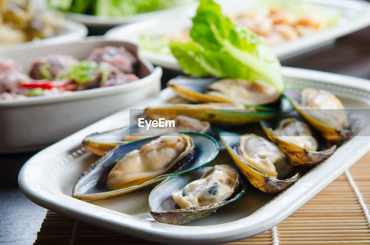 Close-up of seafood in plates on table