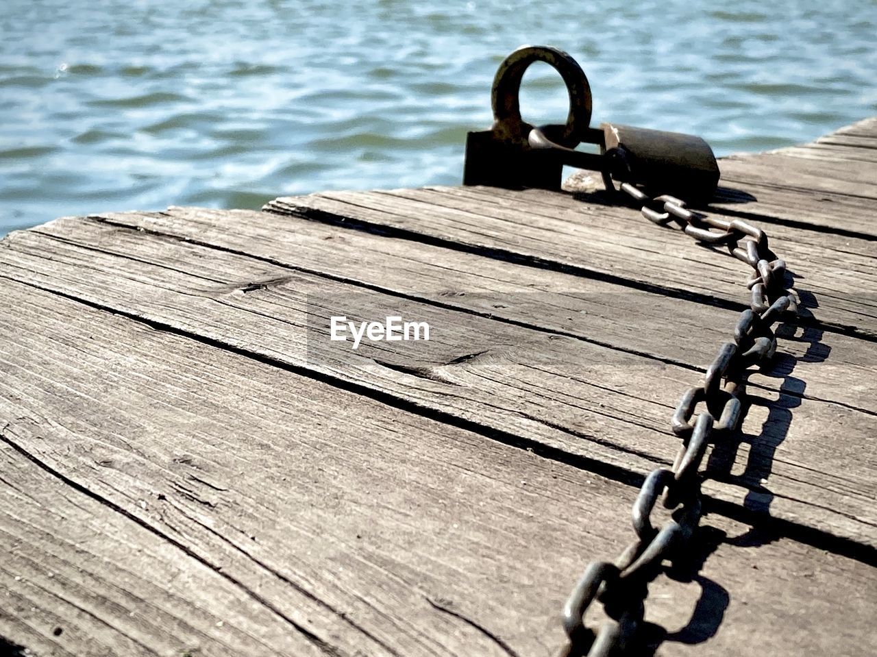 HIGH ANGLE VIEW OF PIER OVER LAKE