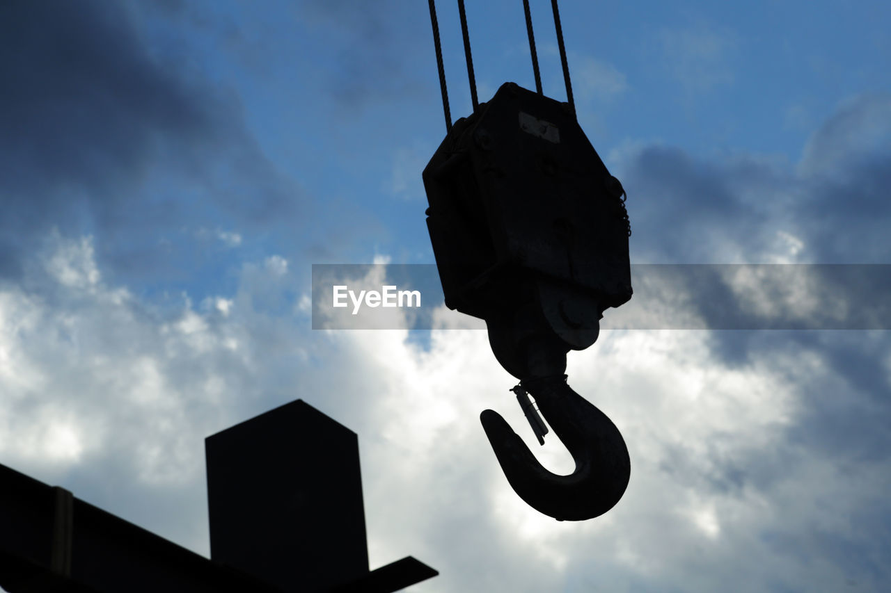 LOW ANGLE VIEW OF SILHOUETTE METAL AGAINST SKY AT DUSK