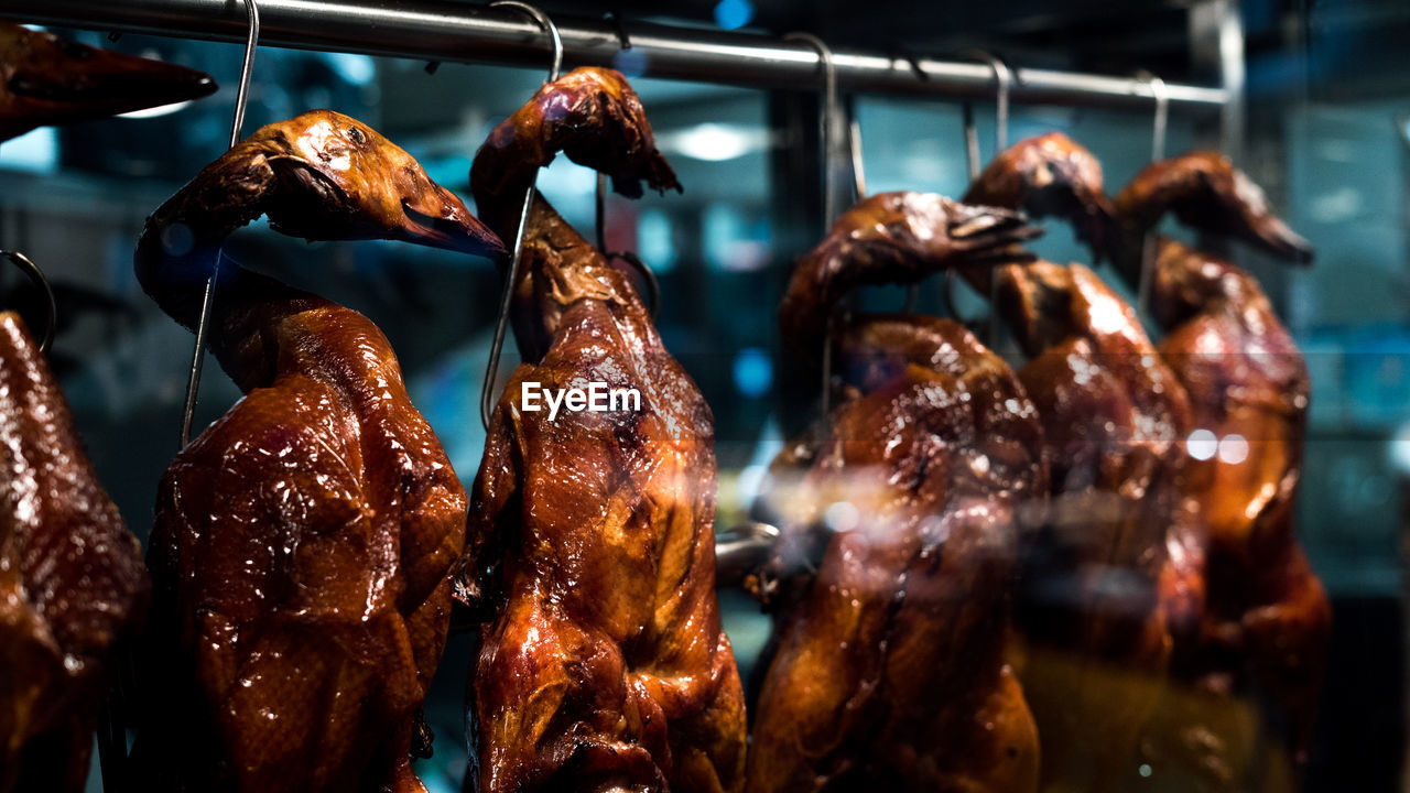 Close-up of meat hanging for sale in store