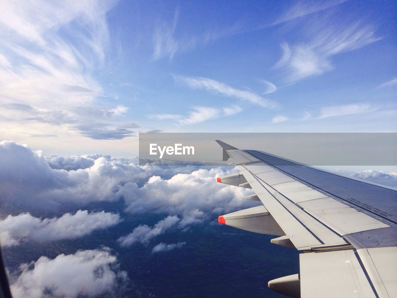 Cropped image of airplane flying in sky