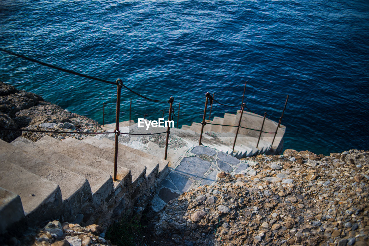High angle view of steps leading towards sea in camogli