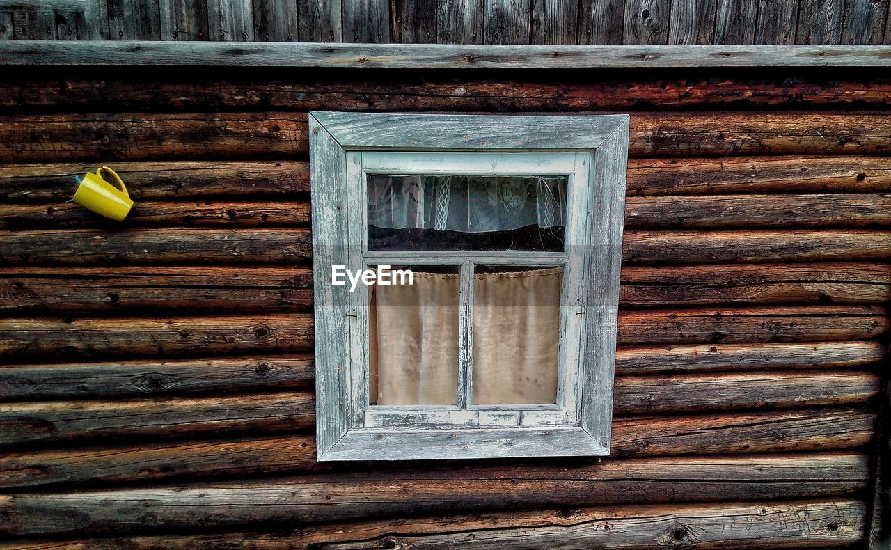 Close-up of window on wooden building
