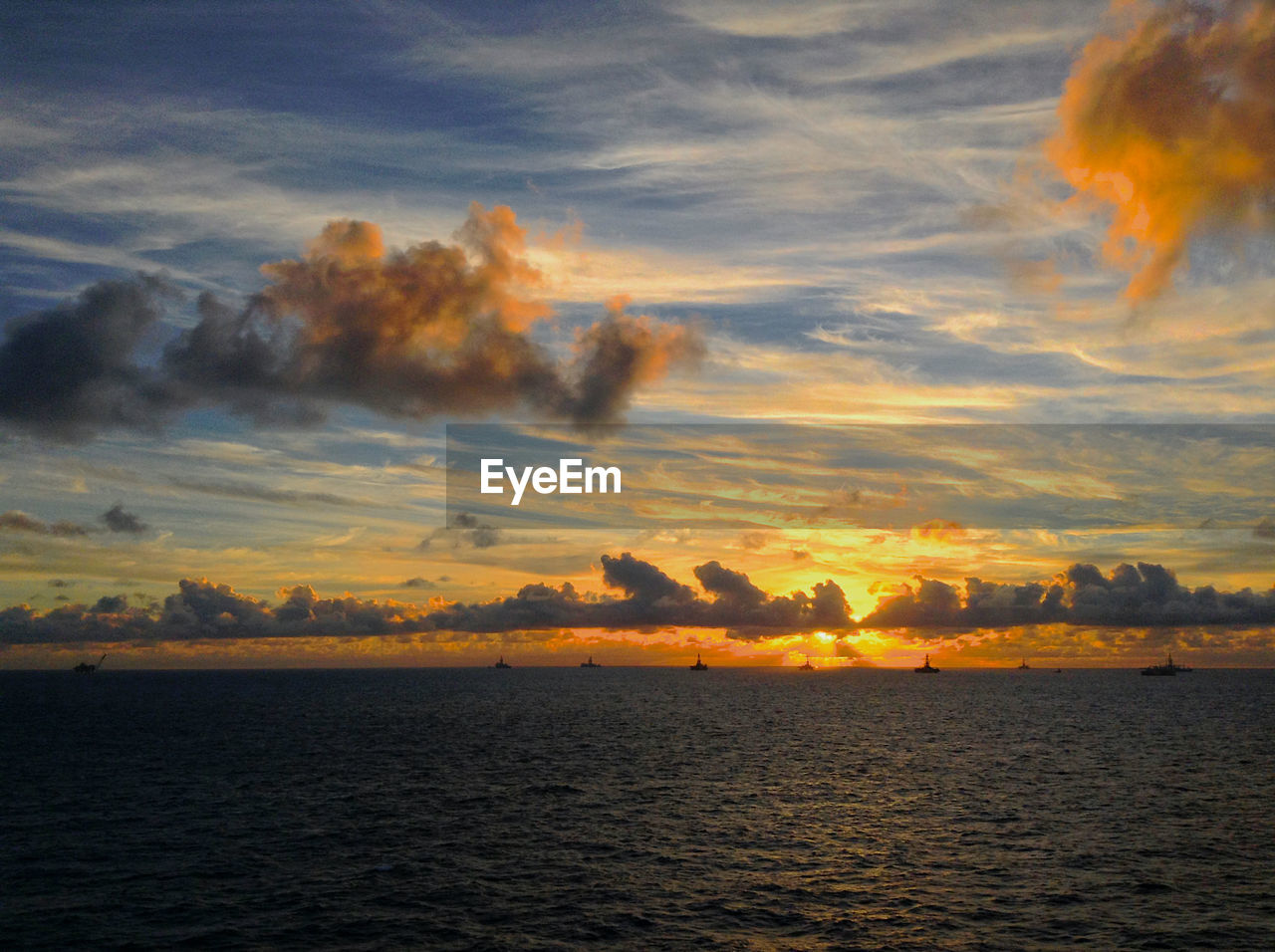 Sunrise over offshore drilling area in brazil