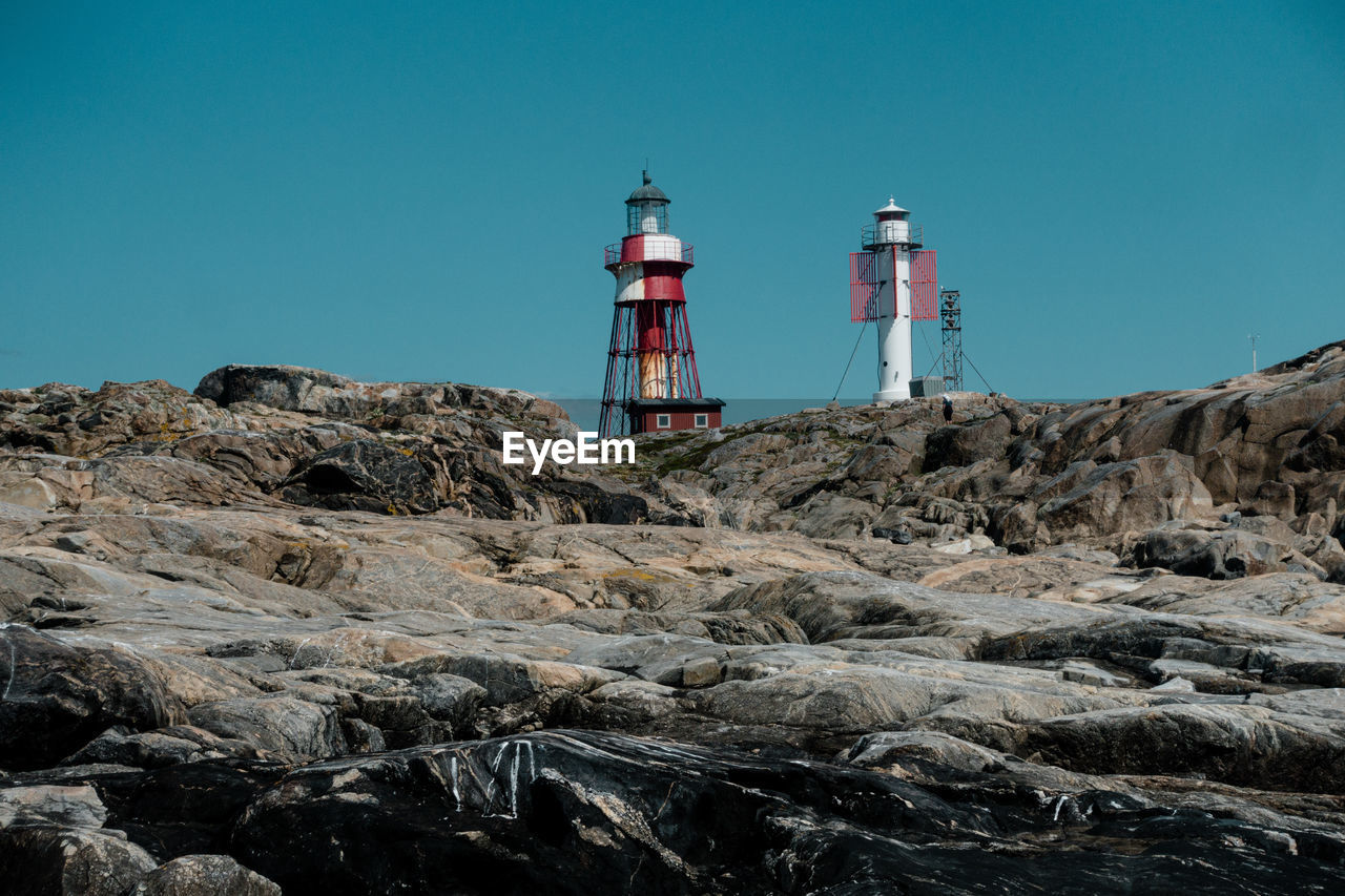 LIGHTHOUSE BY SEA AGAINST SKY