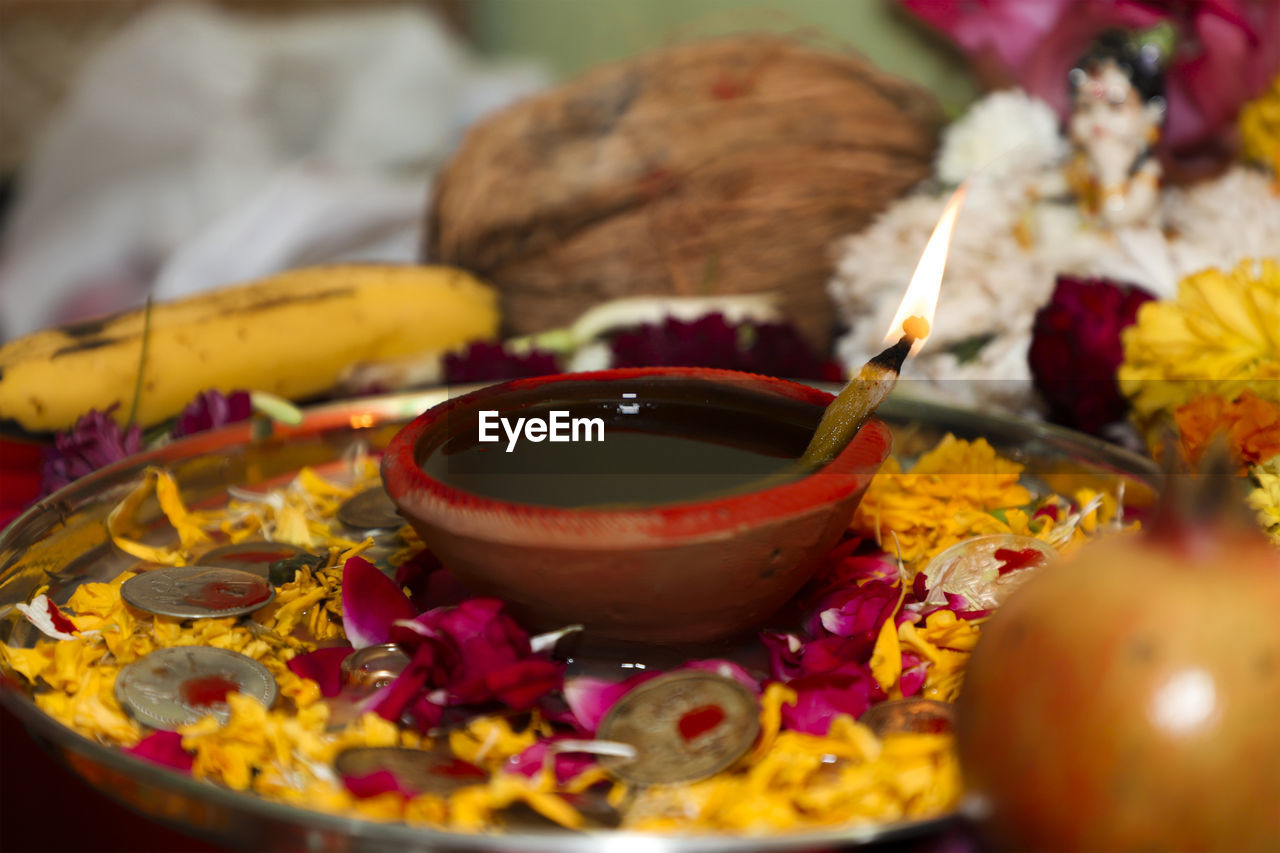 Close-up of various flowers in bowl on table