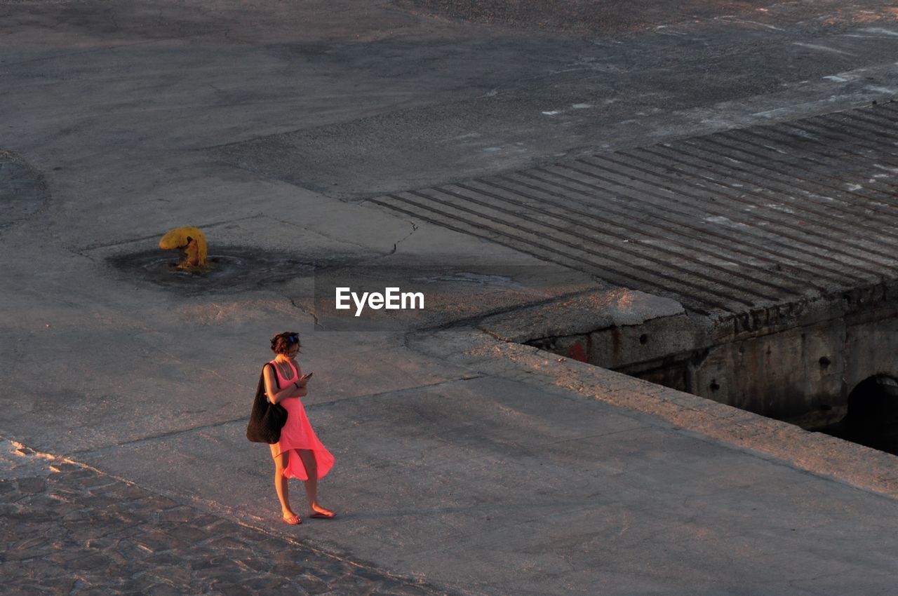 Women in red, on the pier