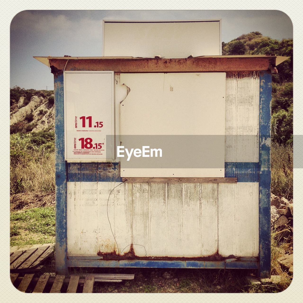 Sign on old wooden cabin outdoors