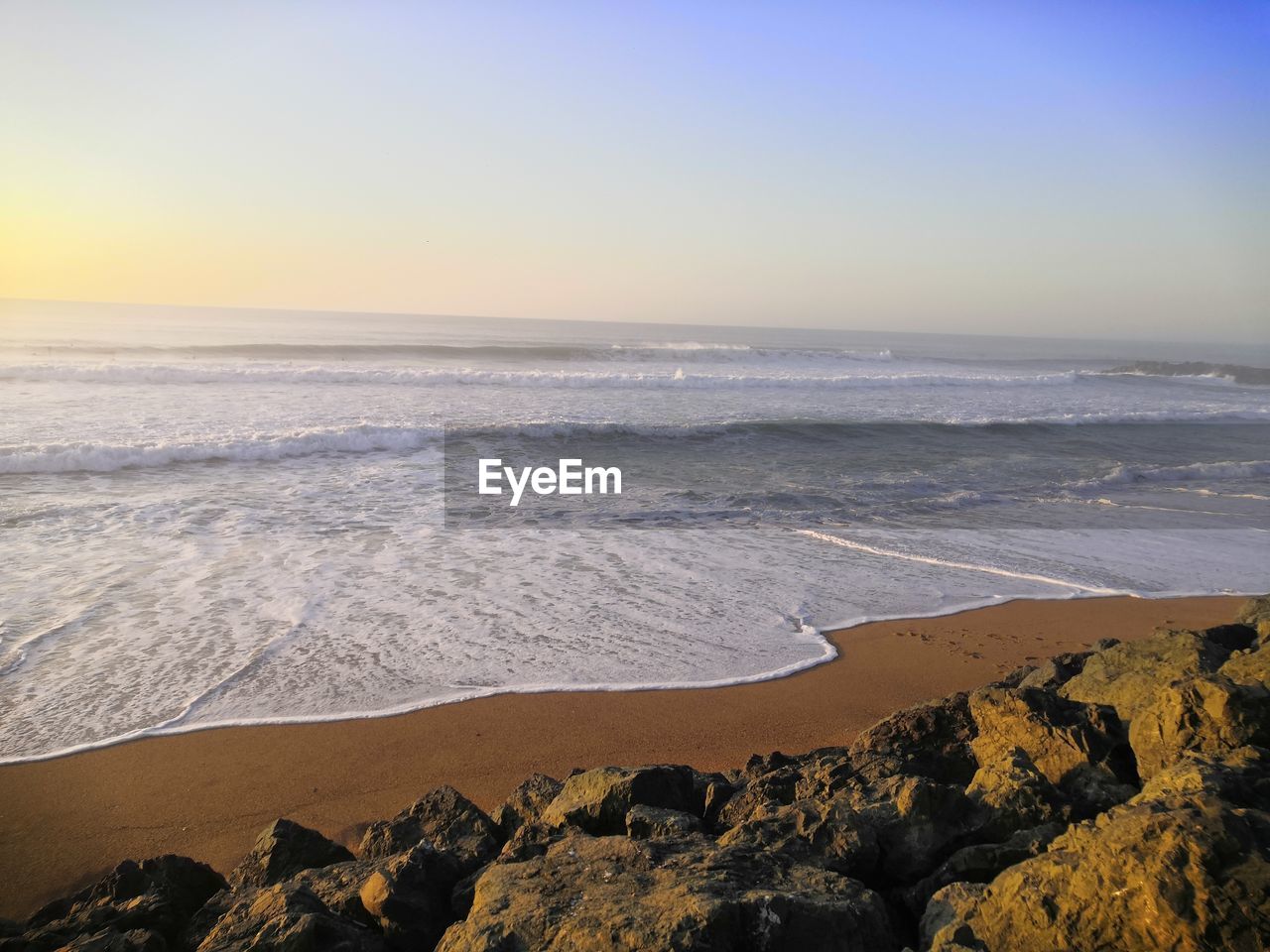 Scenic view of sea against clear sky