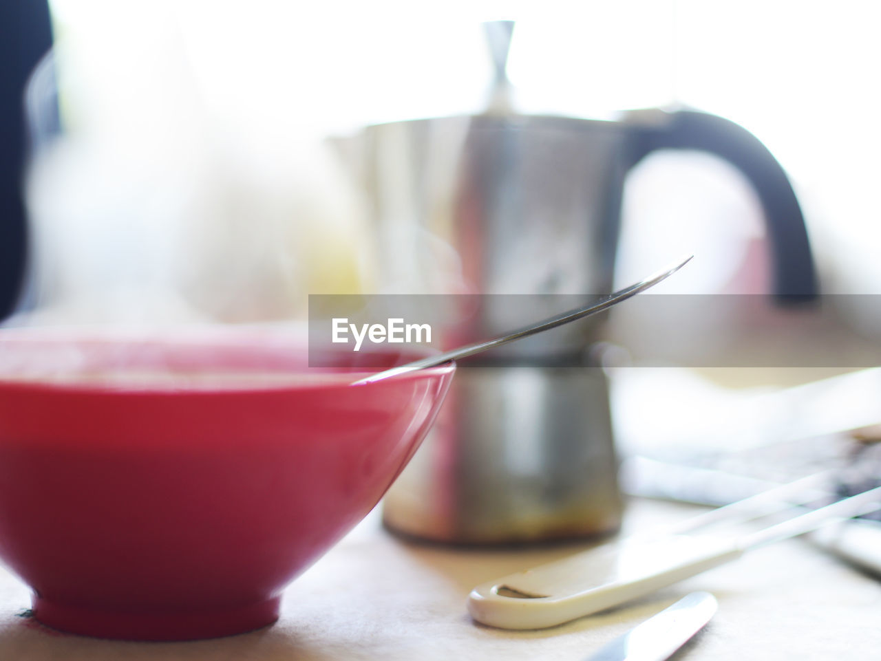 CLOSE-UP OF CUP OF COFFEE ON TABLE