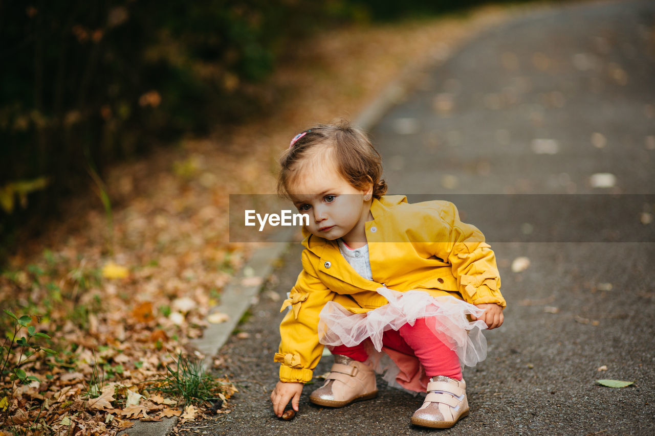 PORTRAIT OF CUTE GIRL ON STREET