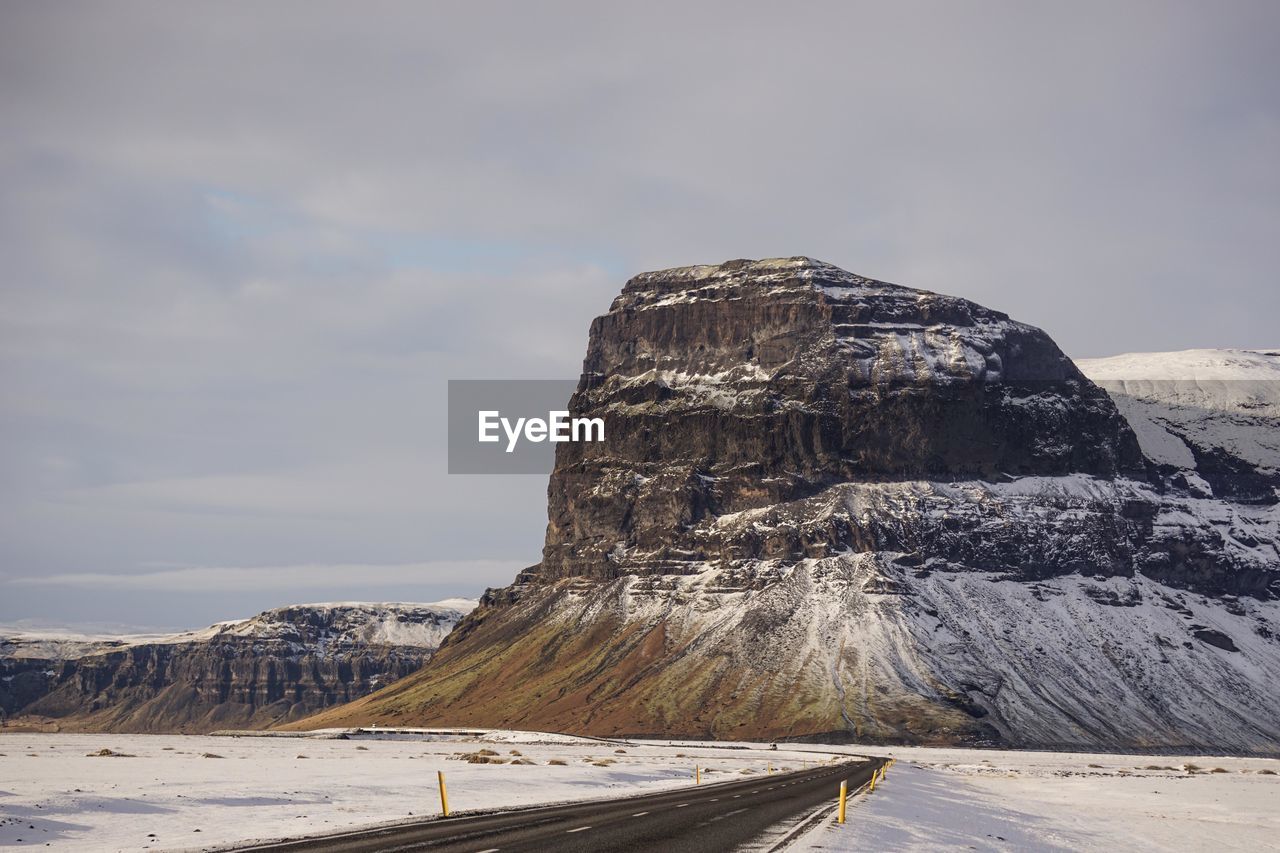 Scenic view of snowcapped mountain against sky