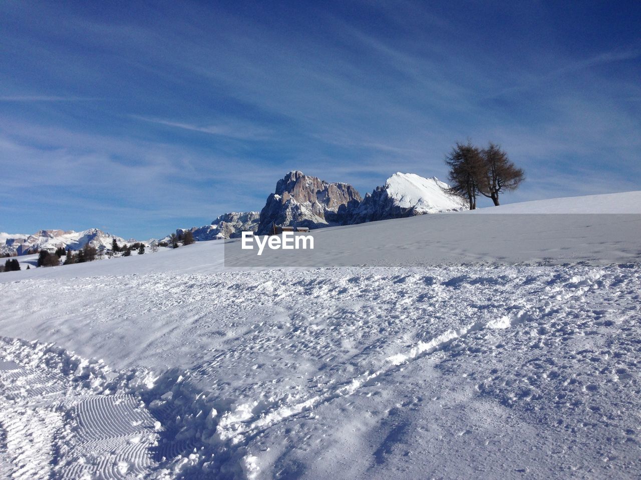 Scenic view of snow covered mountain against sky