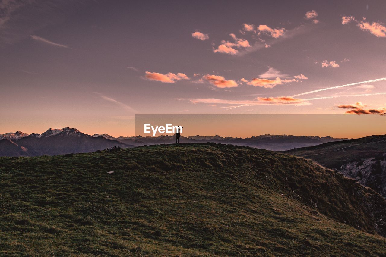 Scenic view of mountains against sky during sunset