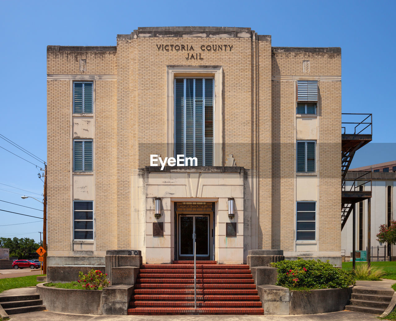 FACADE OF BUILDING AGAINST BLUE SKY