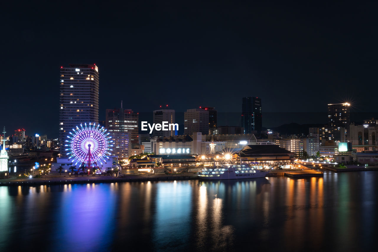 illuminated buildings in city at night