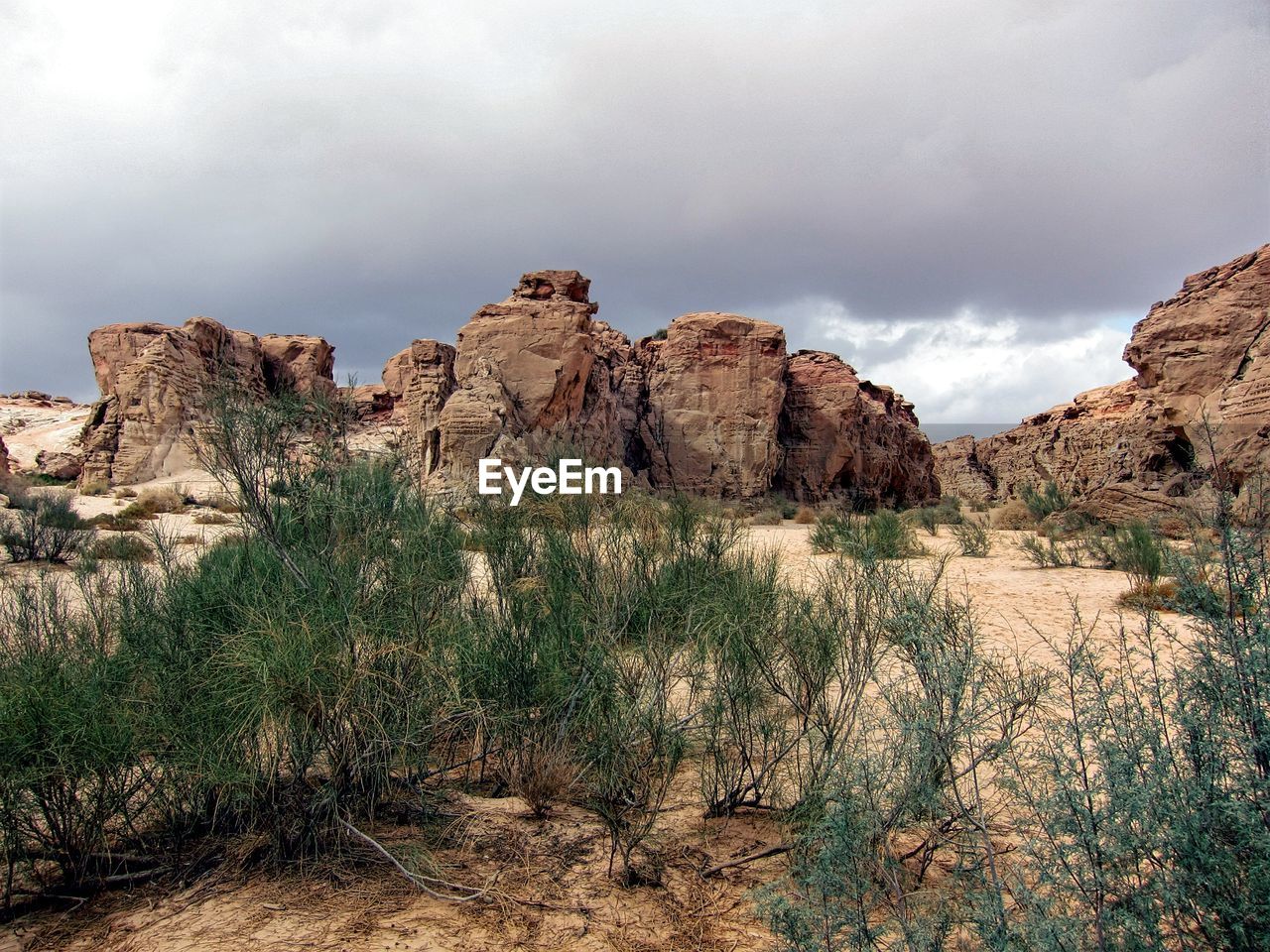 Rock formations on landscape against sky