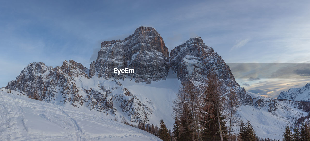 Evening panorama of the majestic north face of mount pelmo in winter conditions