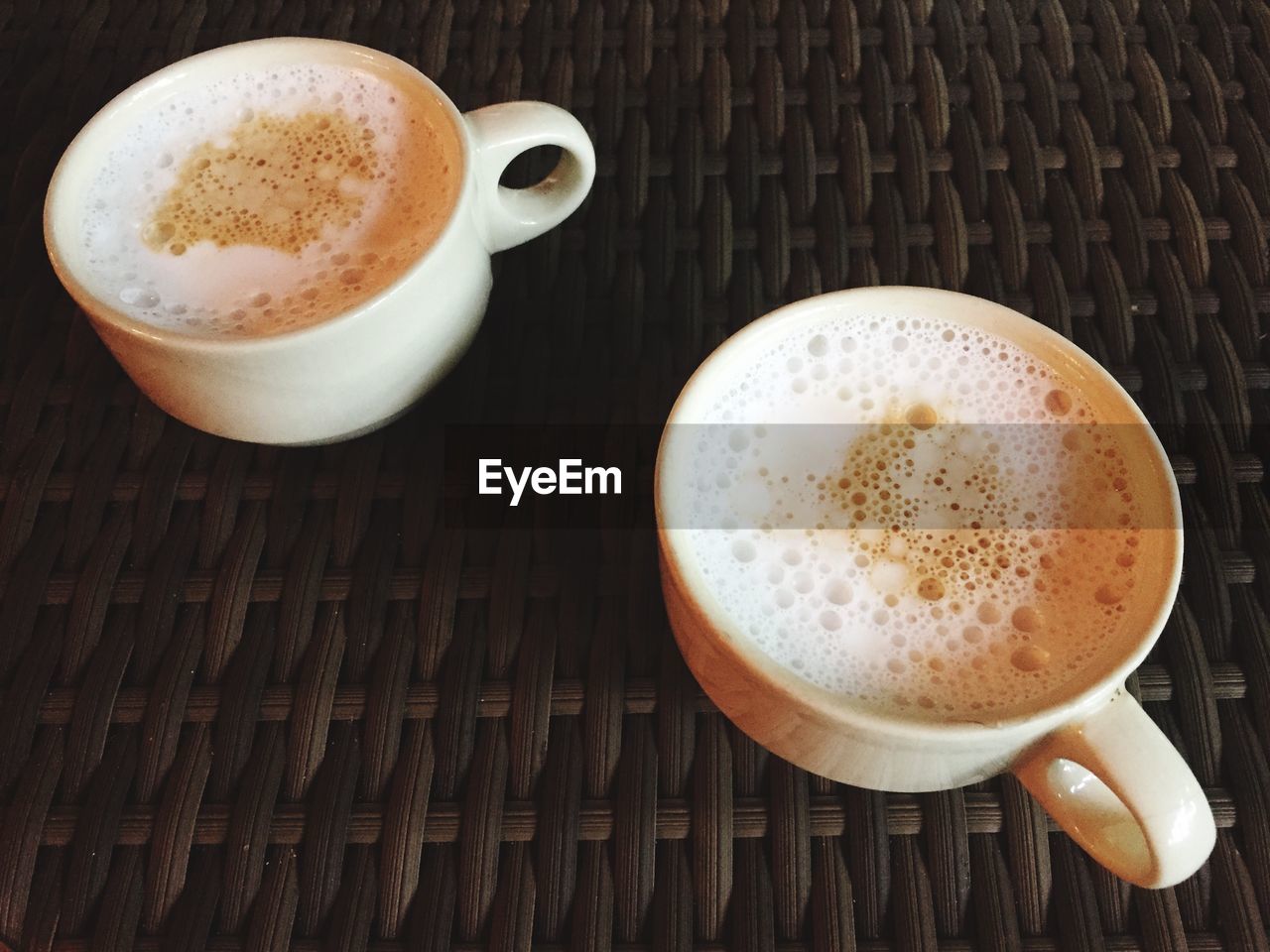 CLOSE-UP OF CAPPUCCINO ON TABLE