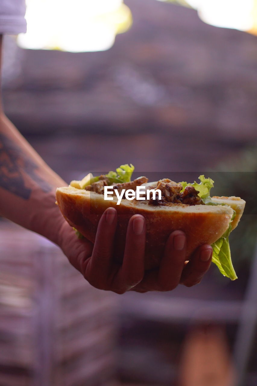 Close-up of hand holding fruit