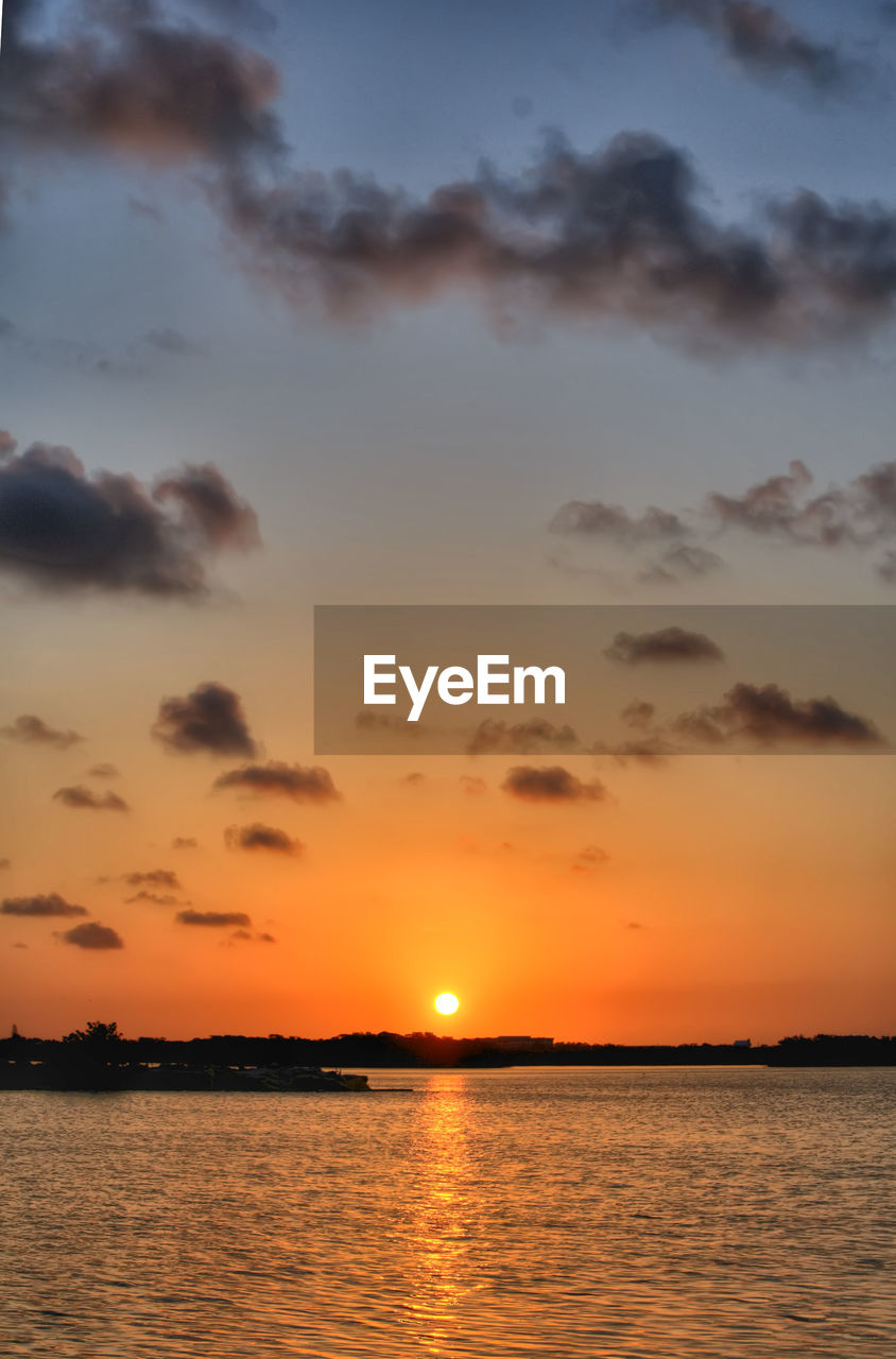 sunset, sky, scenics, orange color, beauty in nature, tranquil scene, nature, tranquility, sun, reflection, water, silhouette, no people, outdoors, sea