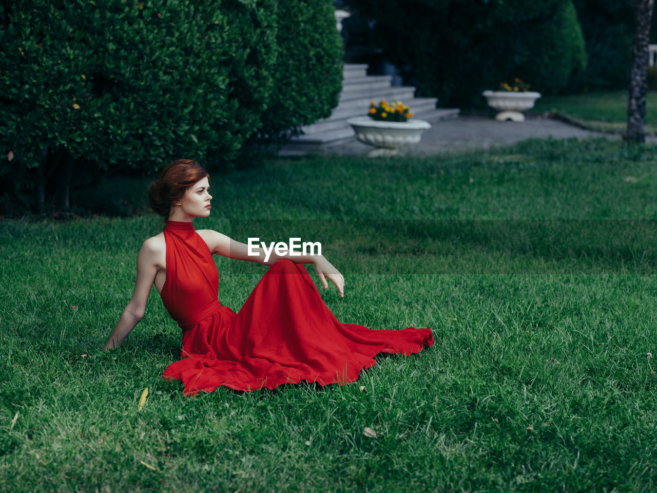 Young woman on grass in field