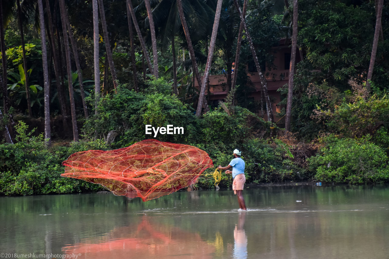 Man fishing in lake