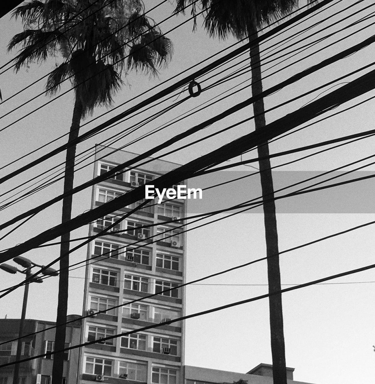 Low angle view of silhouette building against sky