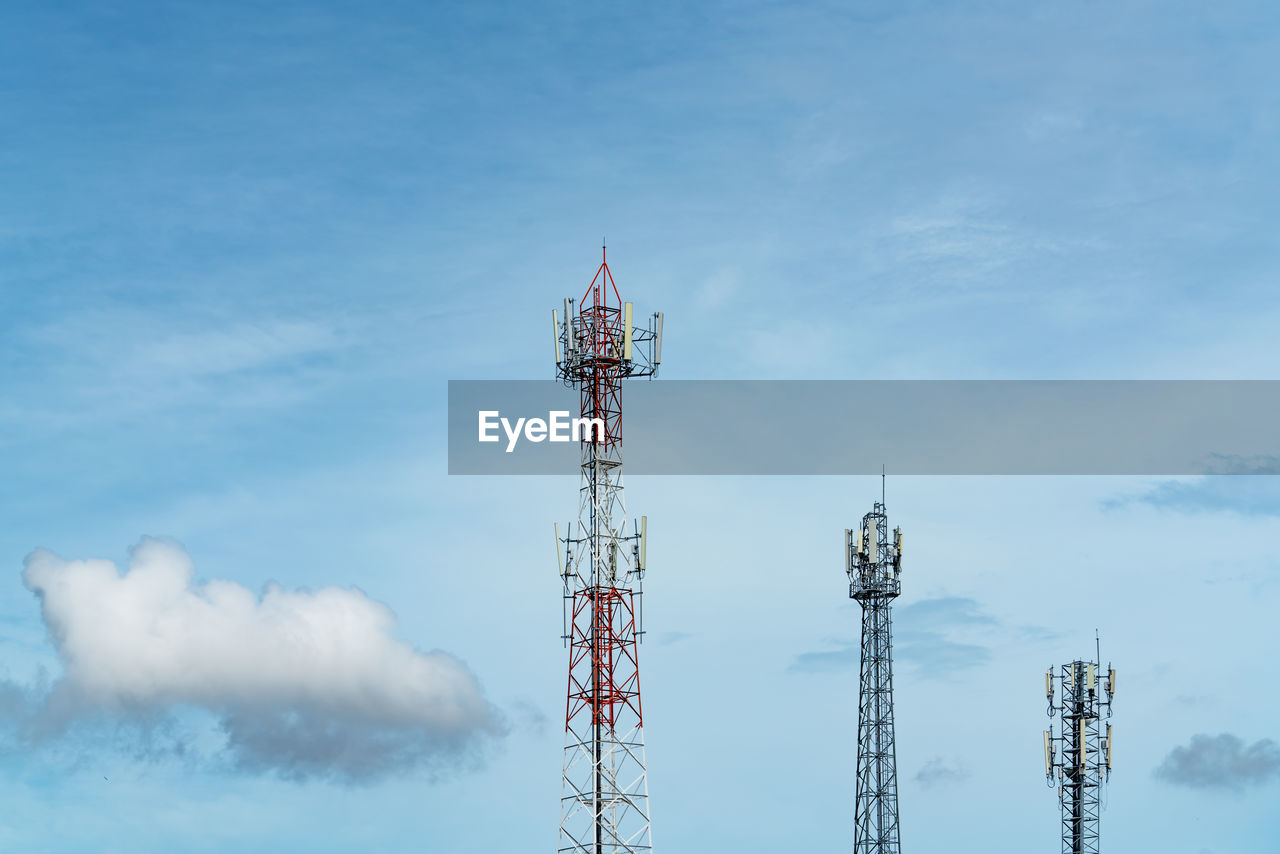 Telecommunication tower with blue sky and white clouds. antenna on blue sky. 